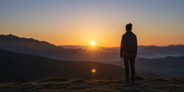 Sunrise over a peaceful landscape, symbolizing hope and renewed mental energy for burnout prevention.